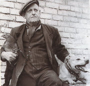 Joe Mallen pictured with "Stowcote Pride" and one of his Gamefowl